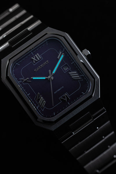 Blue luminous display on Monarch purple dial automatic watch hands and hour markers for enhanced night readability
