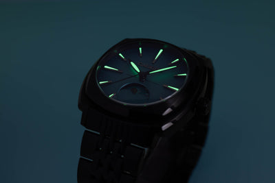Lucent moon phase silver watch with a Aqua Sea Blue dial, luminous needles and marks.