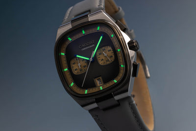 Aeris gray showcasing subdials and six o'clock date window with luminous hands and markers
