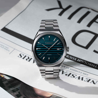 EPOCH Deep Blue Watch With Time Aged Cigar Roll Dial On Newspaper Featuring Polished Stainless Steel Finish