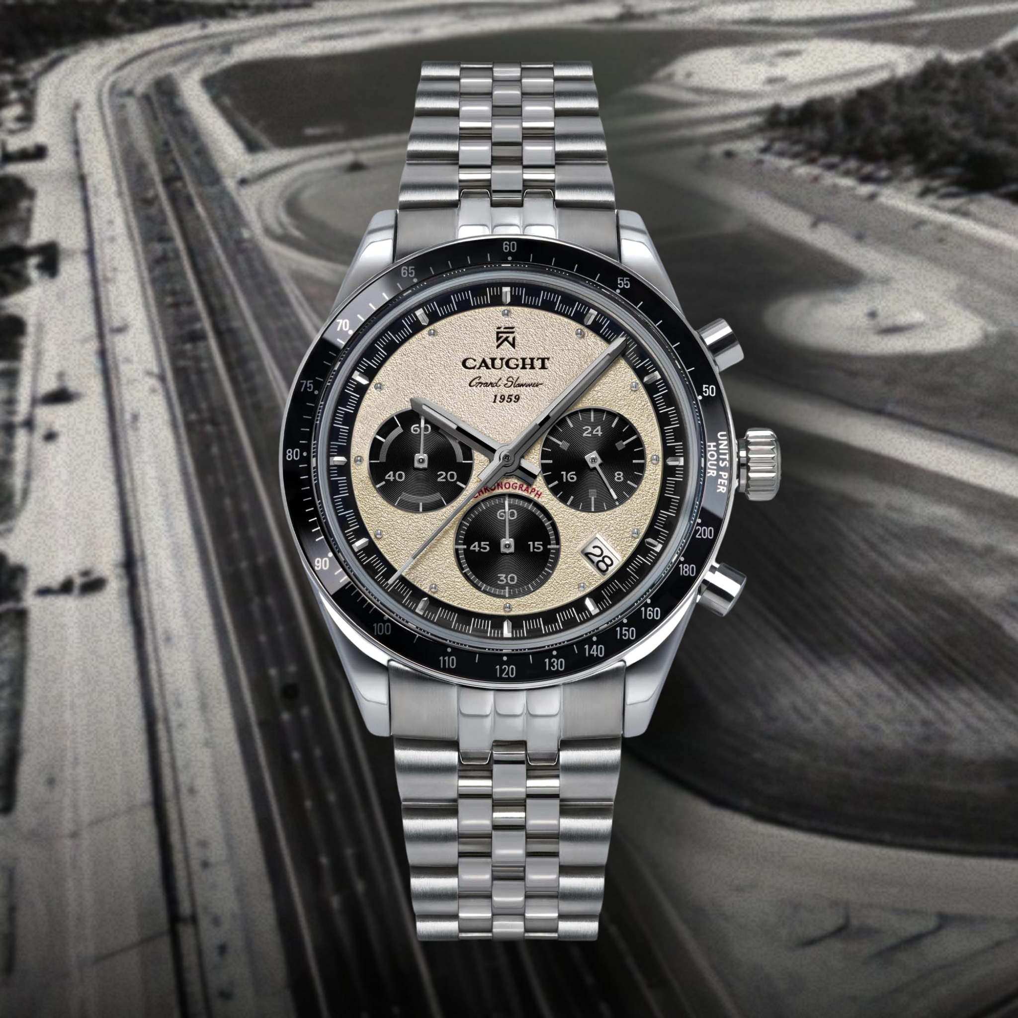 Grand Slammer watch. White asphalt textured surface with three subdials on a background of Daytona Race Track