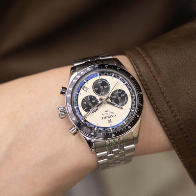 Lifestyle Wear Display Photo of CAUGHT Grand Slammer Watch – White Dial Men’s Watch Paired with Casual Coffee Scene